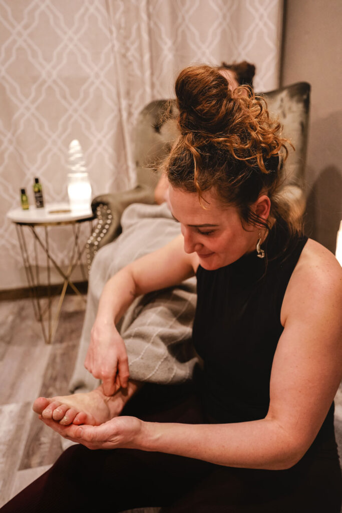 Tristin performing a foot zonology session